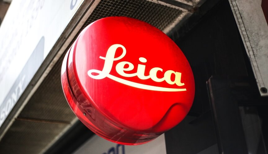 Shinging Leica logo hanging at the side of a Leica store